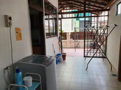 a room with a washing machine in a building at Eden Cosy Living in Batu Ferringhi