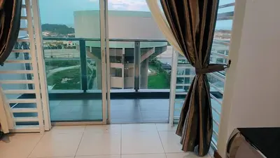 a balcony with a view of a building at Sekinchan PaddyView Homestay \u9ad8\u697c \u770b\u7a3b\u7530 \u9633\u53f0\u6c11\u5bbf in Sekincan