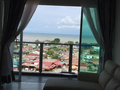 a view of the ocean from a hotel room window at Sekinchan HighLevel SeaView Homestay \u9ad8\u697c \u770b\u6d77 \u9633\u53f0\u6c11\u5bbf in Sekincan