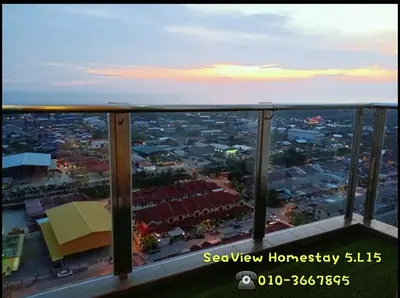 a view of a city from the balcony of a building at Sekinchan HighLevel SeaView Homestay \u9ad8\u697c \u770b\u6d77 \u9633\u53f0\u6c11\u5bbf in Sekincan
