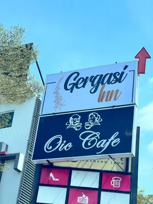 a sign for a croissant inn on the side of a building at Gergasi Inn in Ipoh