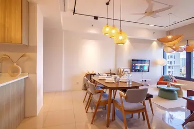 a dining room and kitchen with a table and chairs at Tropicana 218 X Airlevate Suites in George Town
