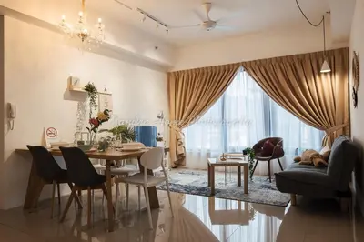 a dining room and living room with a table and chairs at Xandra's 218 Macalister Suite in George Town
