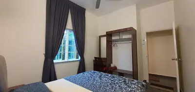 a bedroom with a bed and a window and a mirror at Gerard's 