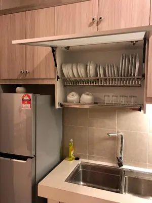 a kitchen with a sink and a stainless steel refrigerator at Brand New Apartment in Local Neighbourhood in Ringlet