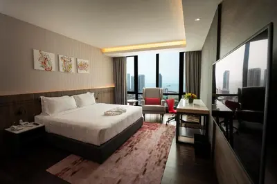 a hotel room with a bed and a view of a city at Jazz Hotel Penang in George Town