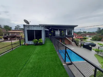 an overhead view of a balcony with green grass at Safar House & Cabin (Muslim) in Kuala Kangsar