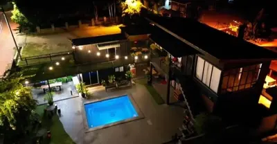 an overhead view of a building with a swimming pool at Safar House & Cabin (Muslim) in Kuala Kangsar