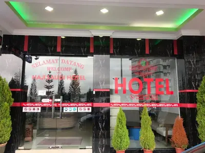 a store window with a hotel sign on it at Haji Saudi Hotel in Cameron Highlands
