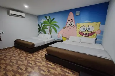 a room with two beds and a painting on the wall at Nova Hotel, Ipoh Tambun in Ipoh