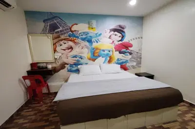 a bedroom with a mural of disney characters on the wall at Nova Hotel, Ipoh Tambun in Ipoh