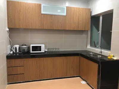 a kitchen with a counter top with a microwave at Meena's Apartment @ The Quintet in Cameron Highlands