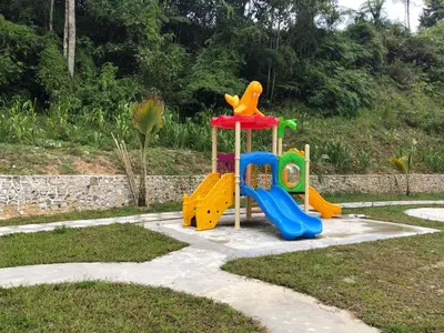a childrens playground with a play equipment in a yard at Meena's Apartment @ The Quintet in Cameron Highlands