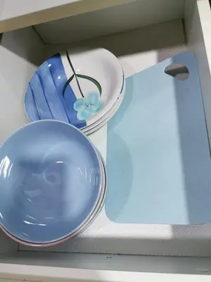 two plates and a bowl on a shelf at 118 Island Plaza Suite City8 by Joal in Tanjong Tokong