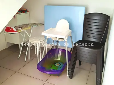 a room with a table and a chair and a dog tunnel at Penthouse - Secret Garden de Cameron, Night Market in Tanah Rata
