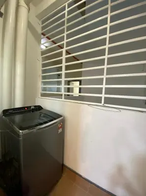 a room with a trash can and a window at One Residence Sekinchan \u9002\u8015\u5e84\u65e0\u654c\u6d77\u666f in Sekincan