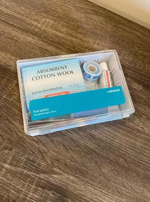 a plastic container with two books on a table at One Residence Sekinchan \u9002\u8015\u5e84\u65e0\u654c\u6d77\u666f in Sekincan