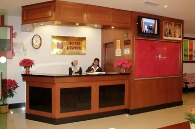 two women sitting at a counter in a hotel room at Jasmine Hotel in Cameron Highlands