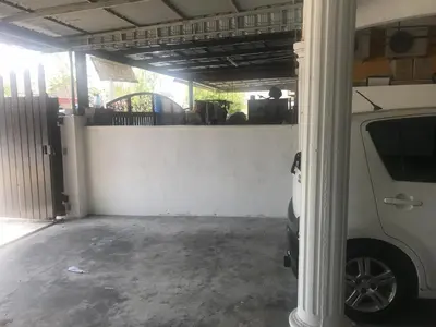 a garage with a white car parked in it at Seri Manjung Homestay Wazer Residence in Lumut
