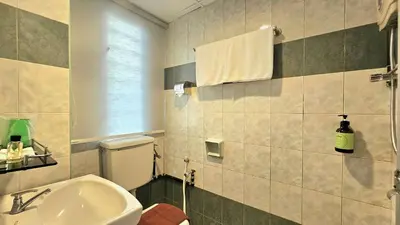 a bathroom with a toilet and a sink at Hotel 22 Gurney, Penang in George Town