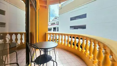 a balcony with a table and chairs on a building at Hotel 22 Gurney, Penang in George Town