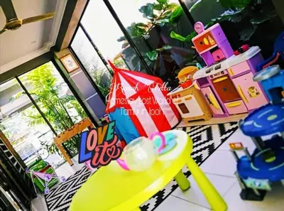 a toy room with a table and a toy house at Rumah Citta Homestay Tambun Ipoh in Ipoh