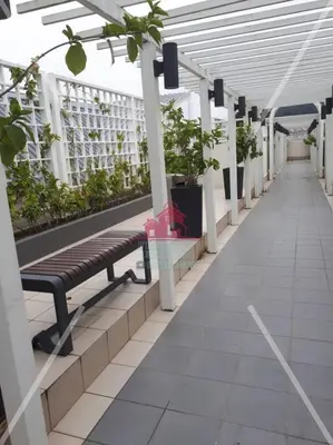 a bench in a building with potted plants at Little Dream (Muslim) Homestay @ Cameron Highlands in Brinchang