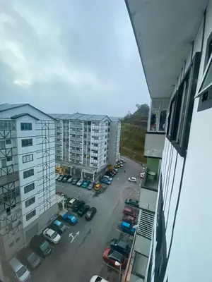 a view of a parking lot from a building at SYA HONEY HOMESTAY with NETFLIX in Cameron Highlands