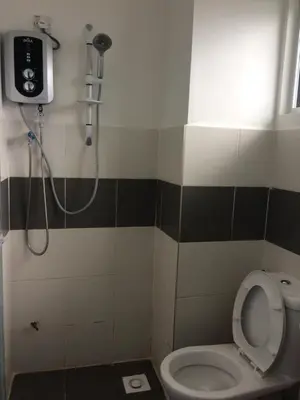 a bathroom with a shower and a toilet at SYA HONEY HOMESTAY with NETFLIX in Cameron Highlands