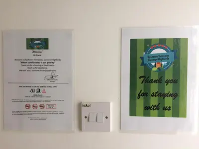 a sign on a wall next to a light switch at SYA HONEY HOMESTAY with NETFLIX in Cameron Highlands