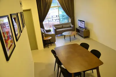 a living room with a table and chairs and a couch at The Woodz Thematic Homestay - Cameron Highlands Golden Hills Night Market in Cameron Highlands