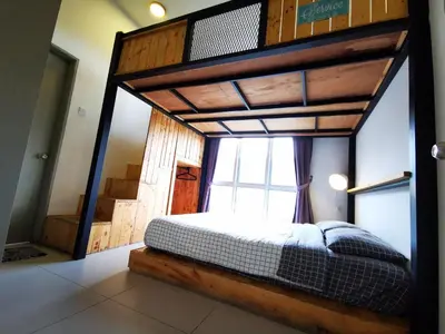 a bedroom with a bunk bed with a window at The Woodz Thematic Homestay - Cameron Highlands Golden Hills Night Market in Cameron Highlands