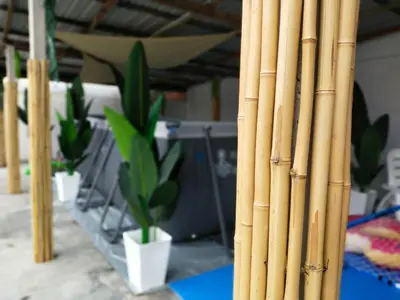 a group of bamboo poles with a potted plant at beXuan-Private Pool-Town Area-Snooker-BBQ-12-18Pax in Ipoh