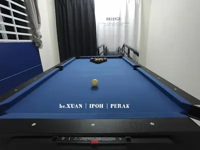 a pool table in a room with at beXuan-Private Pool-Town Area-Snooker-BBQ-12-18Pax in Ipoh
