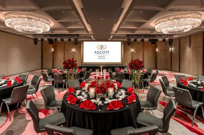 a conference room with tables and chairs and a screen at Ascott Gurney Penang in George Town