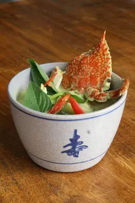 a bowl of salad with a fish on top of it at Victoria Garden Hotel in George Town