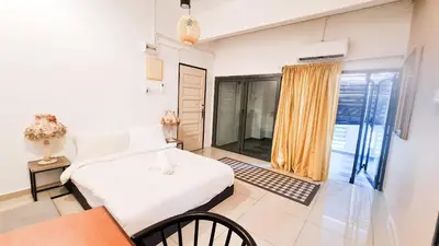 a bedroom with a bed and a large window at The Best Hotel in Bayan Lepas - THE LOV PENANG in Bayan Lepas