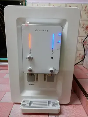a white espresso machine sitting on top of a counter at JSW Inn in Gelugor