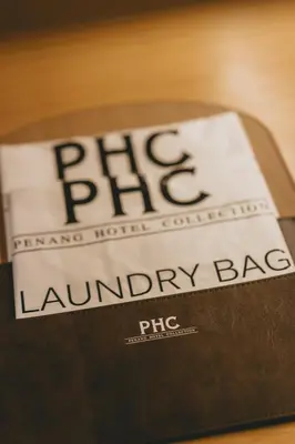 a book with the title of a library bag at Macalister Hotel Managed by The Ascott Limited in George Town