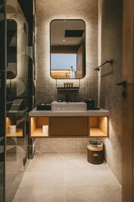 a bathroom with a sink and a mirror at Macalister Hotel Managed by The Ascott Limited in George Town