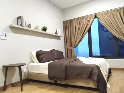 a bedroom with a bed and a large window at Georgetown SeaView Condo Tropicana 218 Macalister in George Town