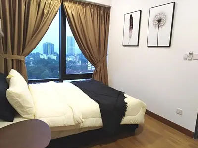 a bedroom with a bed and a large window at Georgetown SeaView Condo Tropicana 218 Macalister in George Town