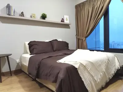 a bedroom with a bed with a large window at Georgetown SeaView Condo Tropicana 218 Macalister in George Town