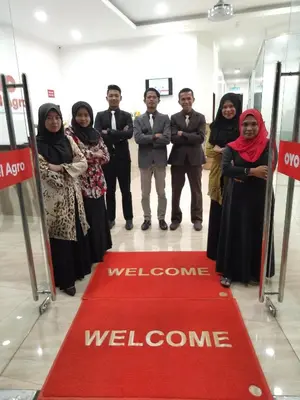 a group of people standing on a red welcome carpet at Hotel Agro in Raub