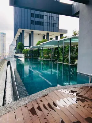 a swimming pool in front of a building at 218 Tropicana Georgetown Penang #B30 2BR for 4-7pax\u6e29\u99a8\u7a9d\u8212\u9002\u4e24\u623f in George Town