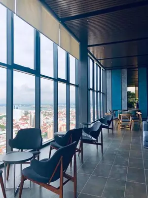 a room with chairs and tables and windows at 218 Tropicana Georgetown Penang #B30 2BR for 4-7pax\u6e29\u99a8\u7a9d\u8212\u9002\u4e24\u623f in George Town