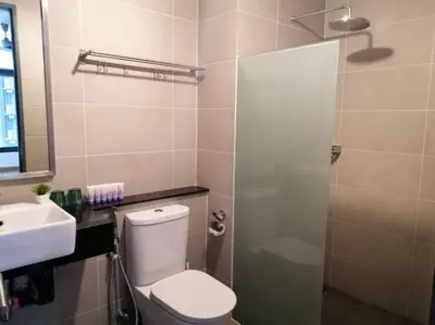 a bathroom with a toilet and a sink and a shower at 218 Tropicana Georgetown Penang #B30 2BR for 4-7pax\u6e29\u99a8\u7a9d\u8212\u9002\u4e24\u623f in George Town