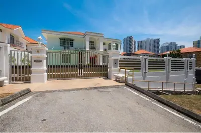 a house with a gate and a fence at 6, Persiaran Tanjung Bunga 3 in Batu Ferringhi