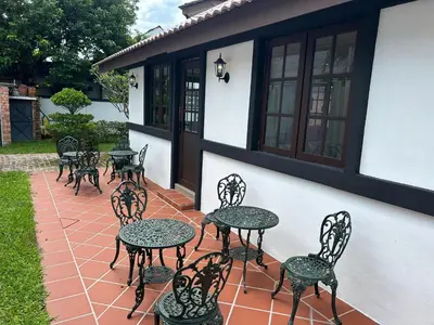 a group of tables and chairs on a patio at The Tudor in Ipoh