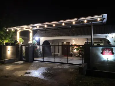 a garage lit up at night with lights on it at Canning 33 in Ipoh